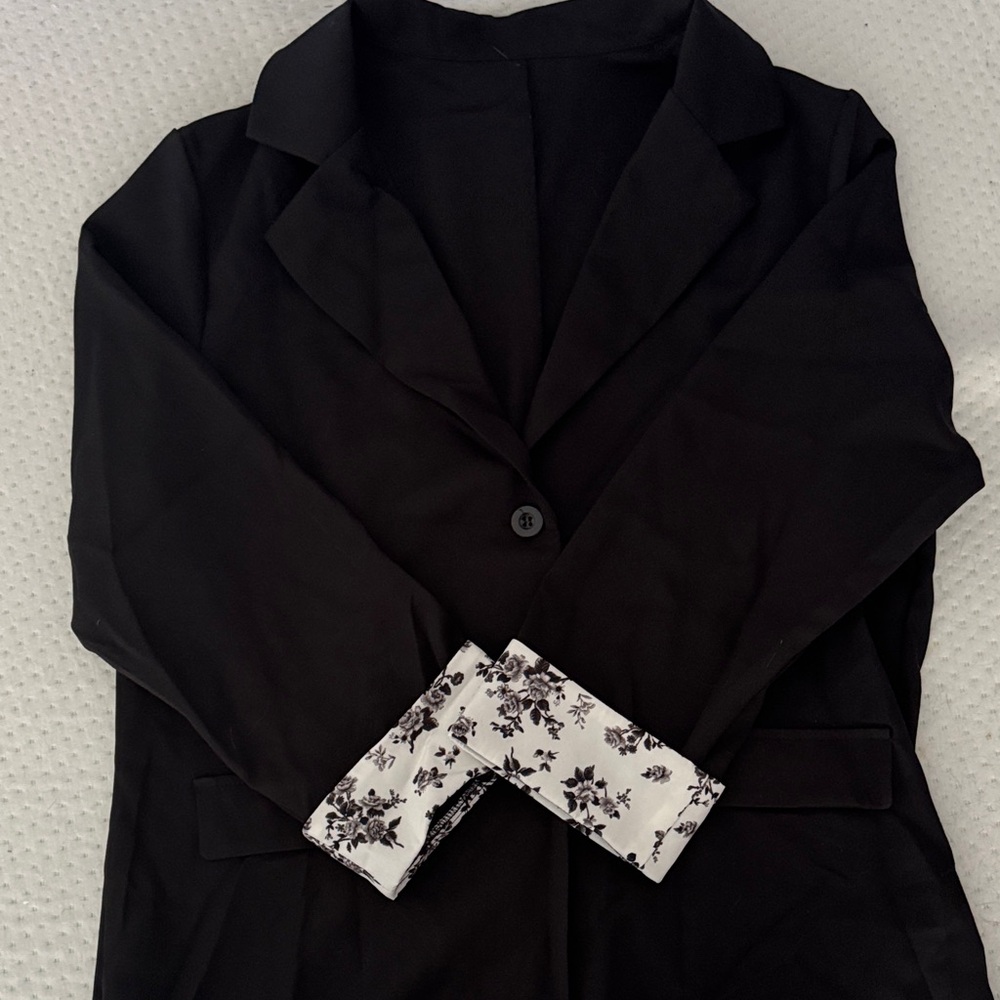 Black blazer with flower design on cuffs